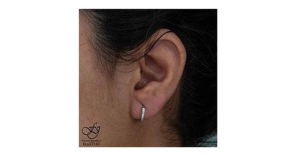 10K White Gold Diamond (0.10 ct. T.W.) Channel Set Huggies