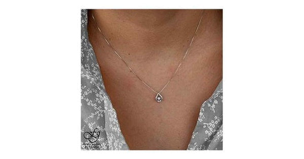 10K White Gold Pulse-Dancing Diamond (0.02 ct. T.W.) Pear Shaped  Necklace