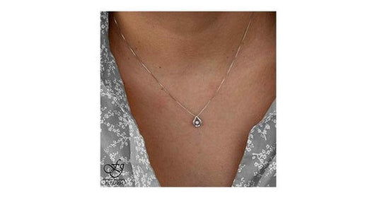 10K White Gold Pulse-Dancing Diamond (0.02 ct. T.W.) Pear Shaped  Necklace
